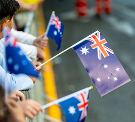 Children waiving the Australian Flag on ANZAC Day